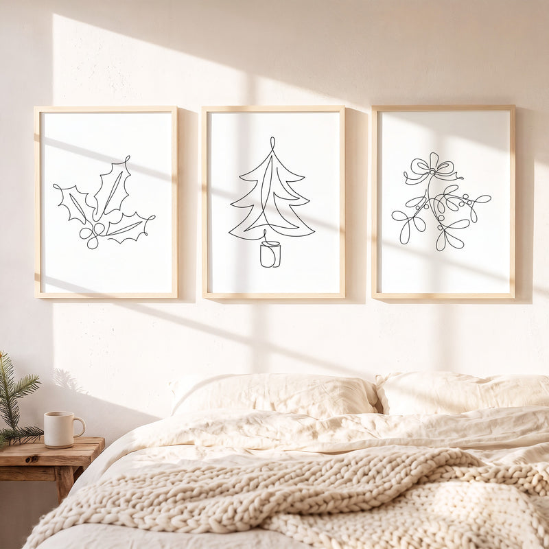 Weihnachtsposter 3er Set One Line gerahmt auf einer Bank