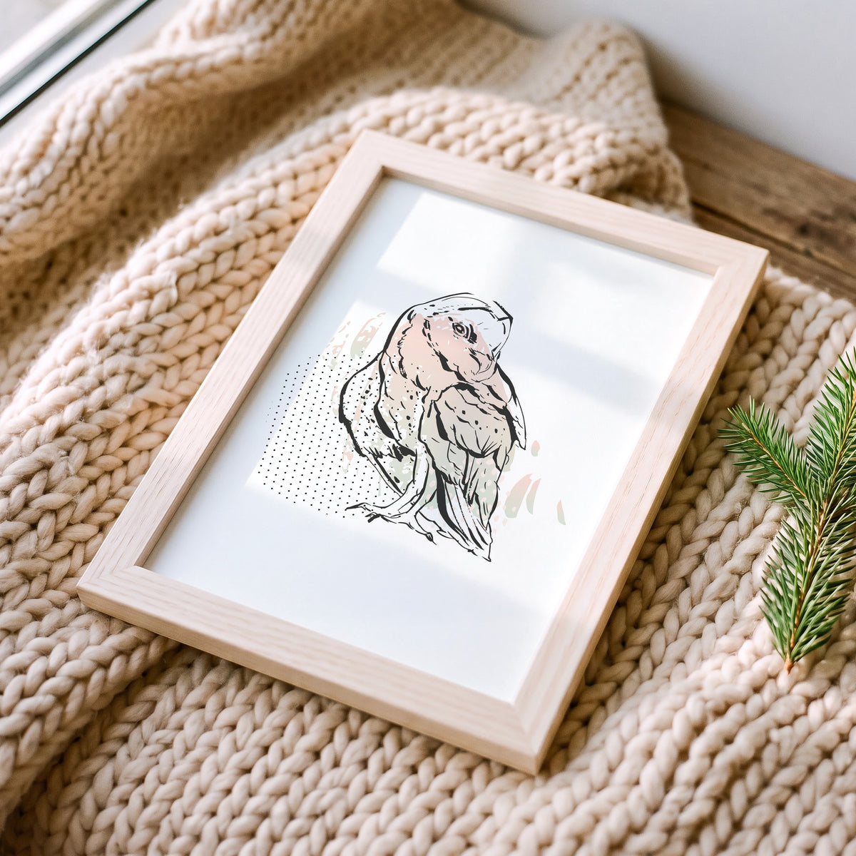 Weihnachtsposter Eule im Holzrahmen auf einer Strickdecke