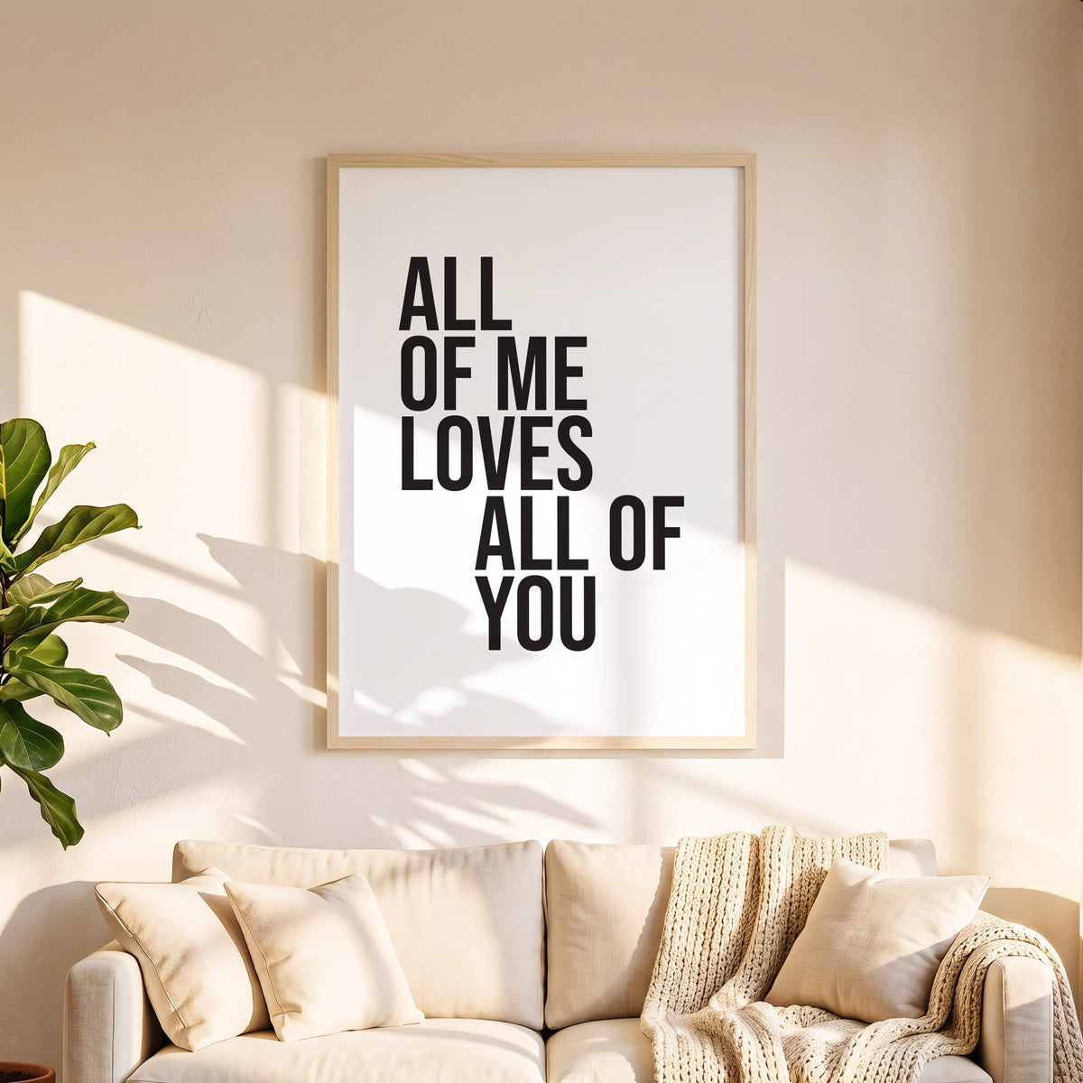 Spruchposter All of me loves all of you in 50 x 70 cm über dem Sofa