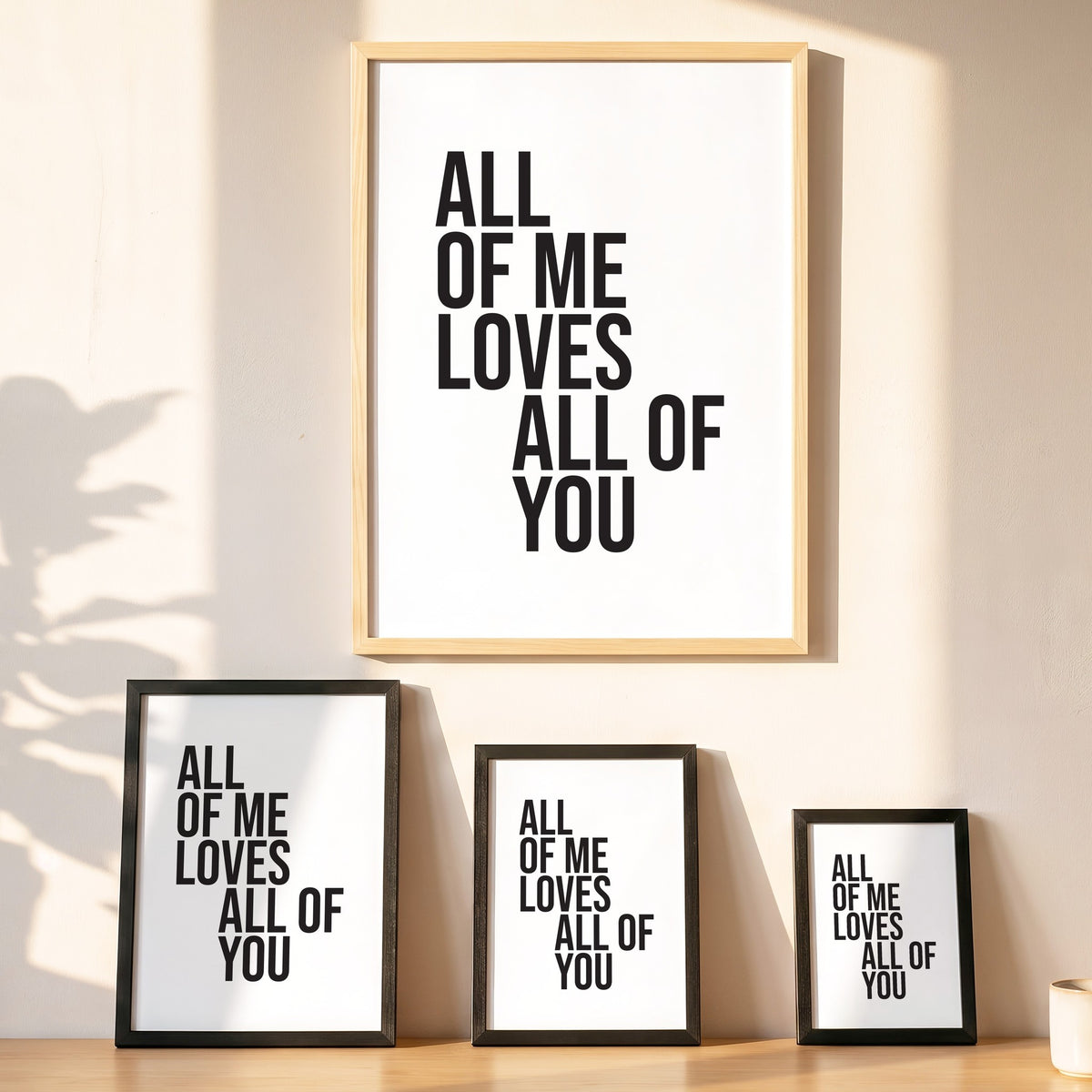 Spruchposter All of me loves all of you in vier Größen an der Wand