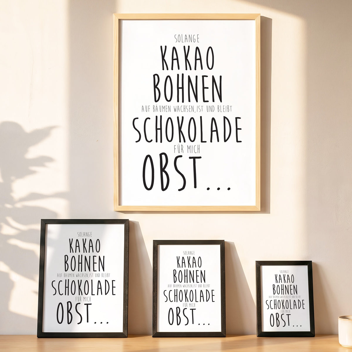 Spruchposter Schokolade ist Obst in vier Größen an der Wand