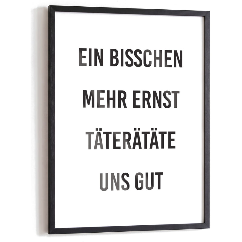 Spruchposter Täterätäte uns gut im schwarzen Holzrahmen