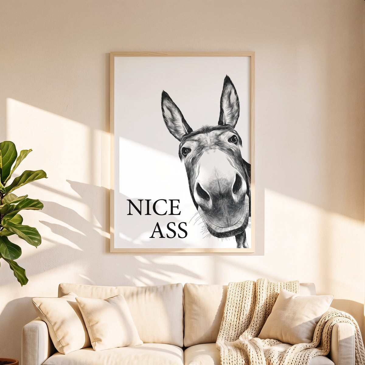 Spruchposter Nice Ass mit Esel in 50 x 70 cm über dem Sofa