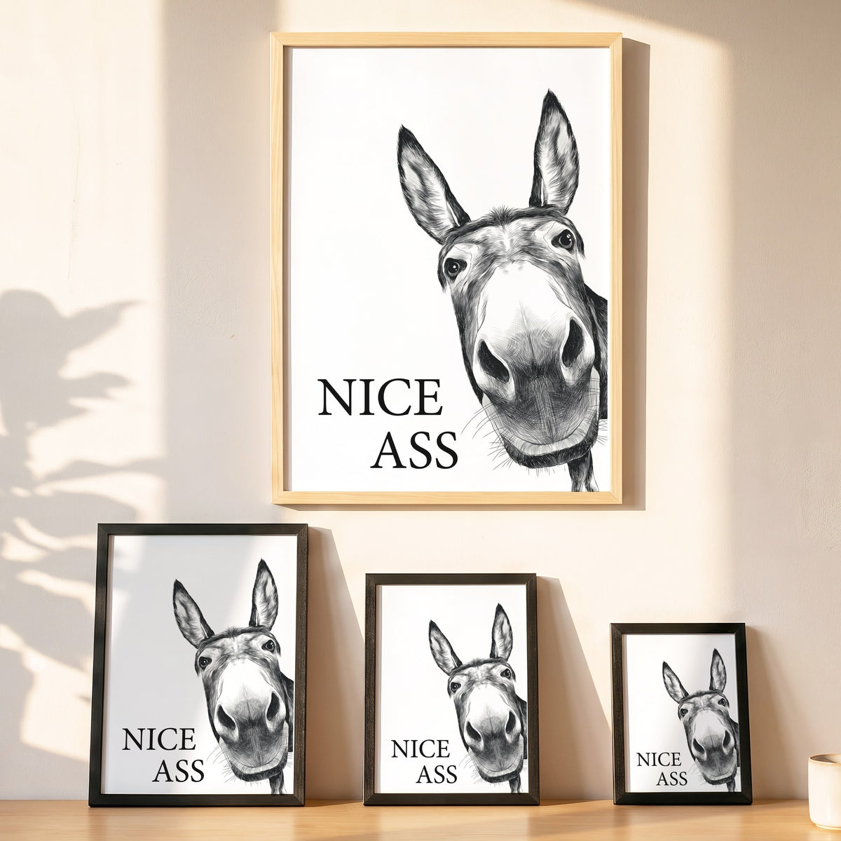 Spruchposter Nice Ass mit Esel in vier Größen an der Wand