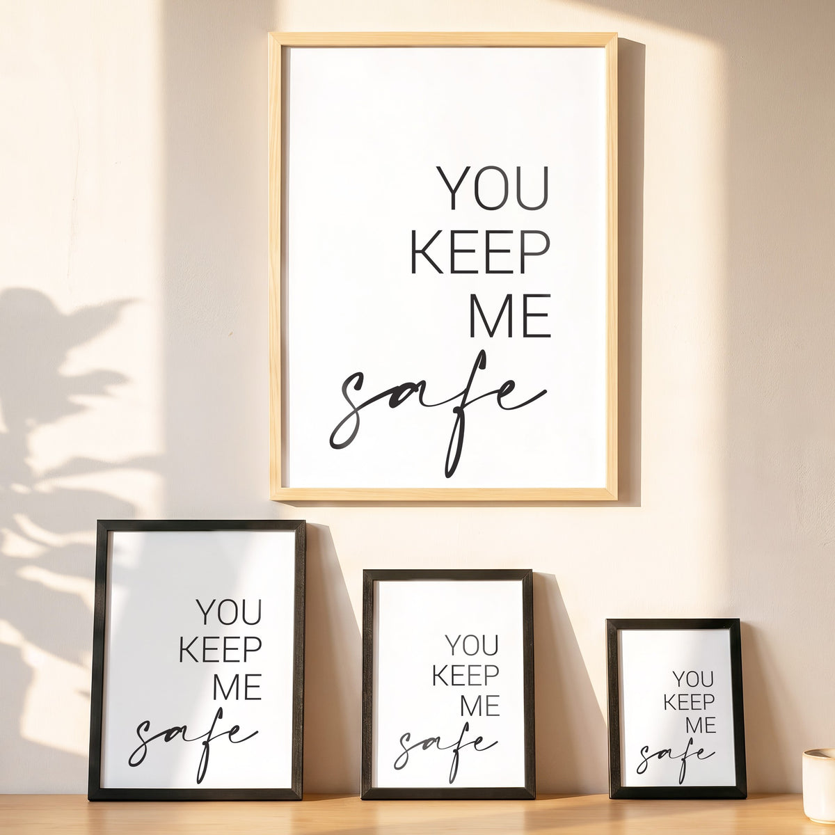Spruchposter You Keep Me Safe, I Keep You Wild in vier Größen an der Wand
