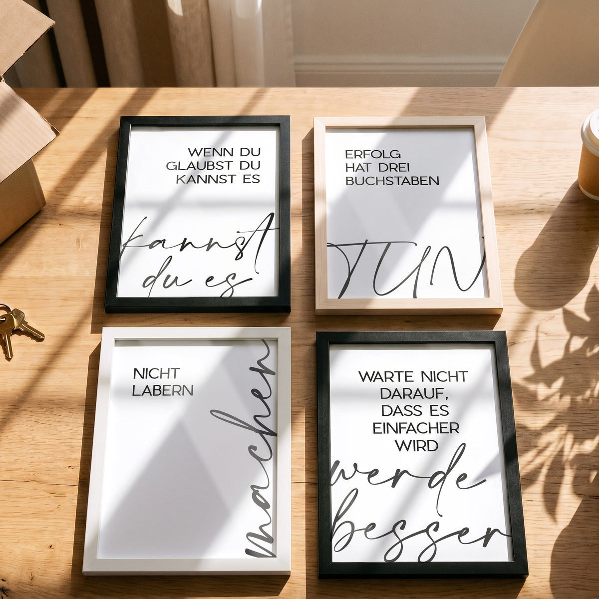 Poster Nicht labern, machen mit weiteren Motiven der Serie auf einem Tisch