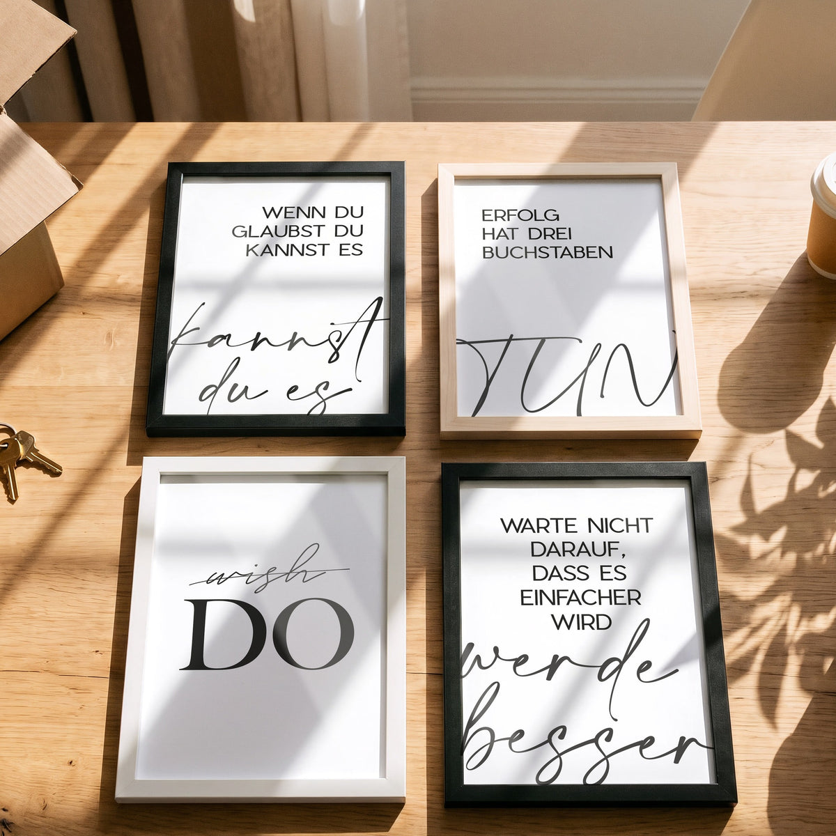 Poster Wish Do mit weiteren Motiven der Serie auf einem Tisch