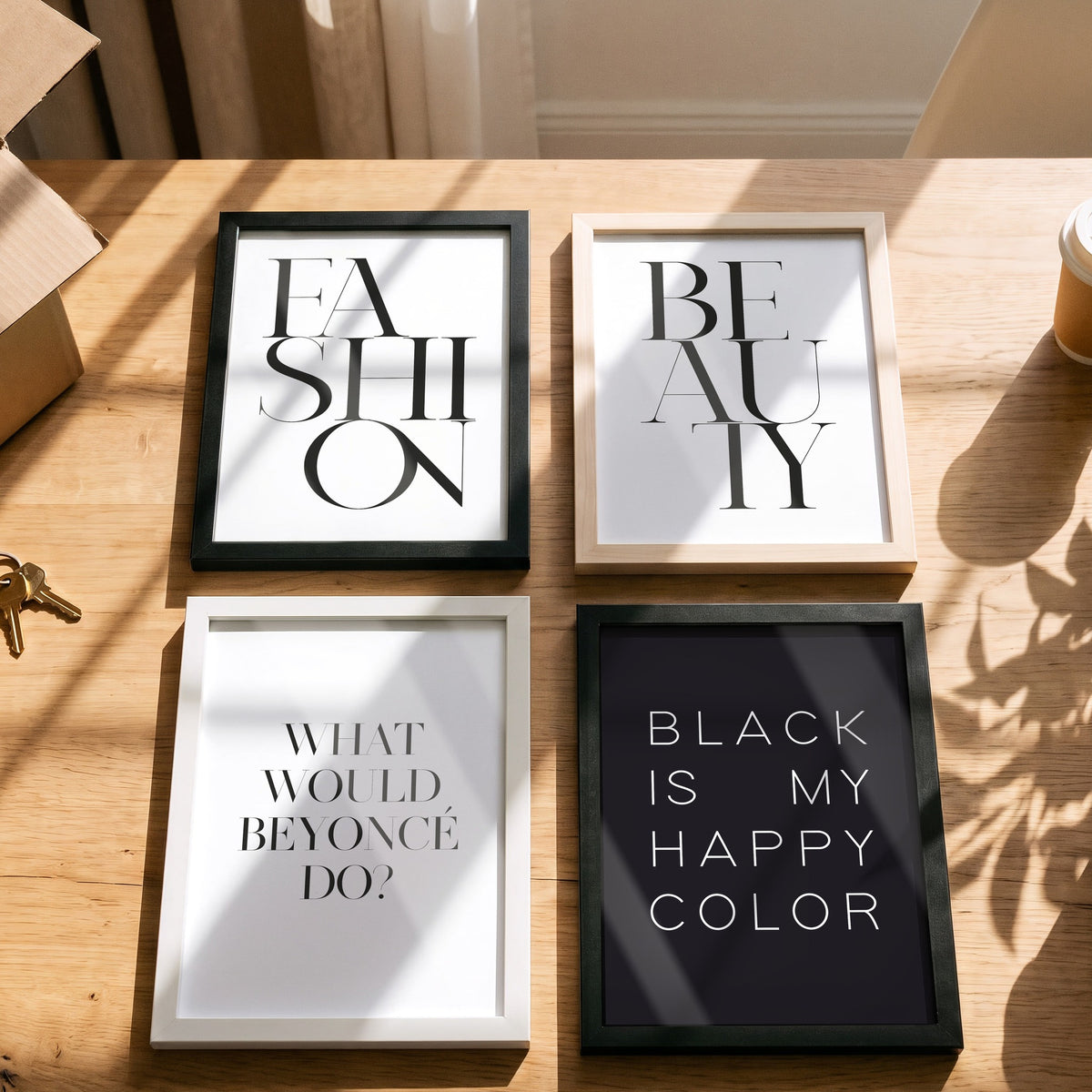 Poster Beyoncé mit weiteren Motiven der Serie auf einem Tisch